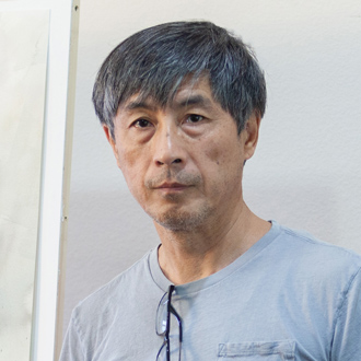 Stephen Zhang facing forward, dark hair, blue T-shirt